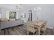 Cozy living room and dining area with a view of the outside at 7671 Comrow St # 303, Kissimmee, FL 34747