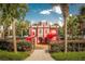This whimsical castle playground, in a gated area, is a fun amenity for children with its slides and colorful features at 7671 Comrow St # 303, Kissimmee, FL 34747