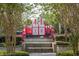Playground featuring a castle play structure, surrounded by lush landscaping and trees at 7671 Comrow St # 303, Kissimmee, FL 34747