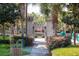 Charming playground entrance with stone archway and lush landscaping at 7671 Comrow St # 303, Kissimmee, FL 34747