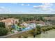 Community waterpark area with slides and pools, surrounded by lush landscaping and trees at 7671 Comrow St # 303, Kissimmee, FL 34747