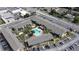Aerial view of the community showcasing buildings, parking, and a central pool at 777 W Lancaster Rd # A-13, Orlando, FL 32809