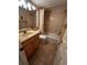 Bathroom with tiled walls, a tiled floor, wood vanity and a shower tub with curtain at 777 W Lancaster Rd # A-13, Orlando, FL 32809