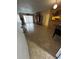 Bright living room with tile floors, a built-in cabinet, and sliding doors at 777 W Lancaster Rd # A-13, Orlando, FL 32809
