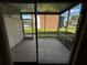 Screened-in back porch with views of exterior community and landscaping at 777 W Lancaster Rd # A-13, Orlando, FL 32809