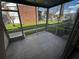 Screened-in back porch with views of exterior community and swimming pool at 777 W Lancaster Rd # A-13, Orlando, FL 32809