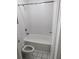 Cozy bathroom with white tiles, toilet, and a shower-tub combo at 7900 S Orange Blossom Trl # 1039, Orlando, FL 32809