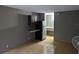 Kitchen space with dark cabinet, drop-down granite table and stainless steel refrigerator at 7900 S Orange Blossom Trl # 1039, Orlando, FL 32809