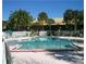 A large, inviting swimming pool surrounded by lush greenery and a well-maintained deck area at 7900 S Orange Blossom Trl # 2075, Orlando, FL 32809