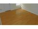Bedroom featuring light colored wood-style flooring, base molding, and a closet at 84 Silver Park Cir, Kissimmee, FL 34743