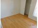 Bright bedroom with wood-style flooring, a closet, and a window for natural light at 84 Silver Park Cir, Kissimmee, FL 34743