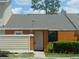 Inviting townhome featuring a well-kept lawn and a cozy front entrance, perfect for a starter home at 84 Silver Park Cir, Kissimmee, FL 34743