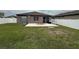 Spacious backyard with patio and fence providing privacy and outdoor enjoyment at 8835 Conway Rd, Polk City, FL 33868