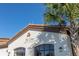 Exterior of clubhouse with 'Tu Casa' sign and palm tree against a vibrant blue sky at 8960 Adriatico Ln, Kissimmee, FL 34747