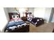 The bedroom includes two twin beds and playful Mickey Mouse decor at 8961 California Palm Rd, Kissimmee, FL 34747