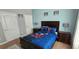 The bedroom features a charming bed with cartoon-themed bedding and coordinating decor at 8961 California Palm Rd, Kissimmee, FL 34747