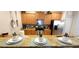 Contemporary kitchen featuring a breakfast bar, granite countertops, and stainless steel appliances at 8961 California Palm Rd, Kissimmee, FL 34747