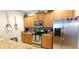 Modern kitchen featuring stainless steel appliances, granite counters, and ample storage at 8961 California Palm Rd, Kissimmee, FL 34747