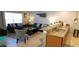 Inviting living room with plush sofas, stylish decor, and an open connection to the kitchen at 8961 California Palm Rd, Kissimmee, FL 34747