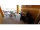 Outdoor patio features a table and chairs, and a BBQ grill at 8961 California Palm Rd, Kissimmee, FL 34747