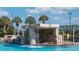 Tranquil waterfall feature adds a touch of nature to the community swimming pool at 8961 California Palm Rd, Kissimmee, FL 34747