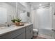 Bathroom with double vanity and shower-tub combo at 956 Cambridge Dr, Winter Haven, FL 33881