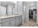 Bathroom featuring double vanity, wood tile floors, and walk-in closet at 956 Cambridge Dr, Winter Haven, FL 33881