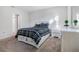 Comfortable bedroom featuring plush carpet and a black and white comforter at 956 Cambridge Dr, Winter Haven, FL 33881