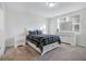 Bright bedroom with a large window, carpeted floor, and white furniture at 956 Cambridge Dr, Winter Haven, FL 33881
