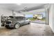 Spacious garage with an open door revealing a view of the house across the street at 956 Cambridge Dr, Winter Haven, FL 33881