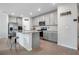 Well-lit kitchen with stainless appliances and a kitchen island at 956 Cambridge Dr, Winter Haven, FL 33881