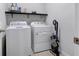 Laundry room with washer, dryer and shelving at 956 Cambridge Dr, Winter Haven, FL 33881