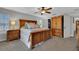Cozy bedroom featuring a wood bed frame, ceiling fan, and closet for ample storage at 6845 Old Melbourne Hwy, St Cloud, FL 34771
