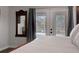 Bright bedroom showcasing a full glass door to the pool area at 6845 Old Melbourne Hwy, St Cloud, FL 34771