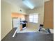 Well-lit kitchen with white appliances and a large window for natural light at 1001 Via Santae Ln # 201, Celebration, FL 34747