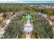 Aerial view of condos with a community pool, mature trees and landscaping at 1017 Siena Park E Blvd, Celebration, FL 34747