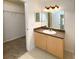 Well-lit bathroom featuring a vanity with a sink and a framed mirror at 1017 Siena Park E Blvd, Celebration, FL 34747