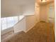 Hallway featuring neutral walls, carpeted floor, and a window to bring in natural light at 1017 Siena Park E Blvd, Celebration, FL 34747