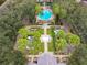 Overhead view of community pool and grounds with palms, fountain and meticulous landscaping at 1017 Siena Park E Blvd, Celebration, FL 34747