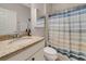 Granite countertop bathroom featuring a toilet and a cabinet over the bowl at 1036 Salamanca Pl, Davenport, FL 33837