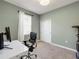 Spare bedroom configured as office space with plenty of light and neutral paint at 1036 Salamanca Pl, Davenport, FL 33837