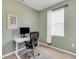 Spare bedroom configured as office space, with a large window providing natural light at 1036 Salamanca Pl, Davenport, FL 33837