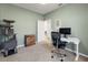 Spare bedroom configured as office space with desk and cat tree at 1036 Salamanca Pl, Davenport, FL 33837