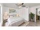 Bright bedroom features stylish decor, plush rug, and a modern ceiling fan at 1067 Ronlin St, Haines City, FL 33844