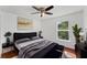 Bedroom features a dark wood floor, stylish decor, and a cozy atmosphere at 1067 Ronlin St, Haines City, FL 33844