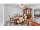 Elegant dining room featuring a classic wood table, chairs, hutch and stylish chandelier at 1067 Ronlin St, Haines City, FL 33844