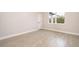 Bright bedroom featuring tile flooring, neutral walls and a side-view window at 12691 Sw 33Rd Ave, Ocala, FL 34473