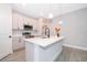 Modern kitchen island featuring a quartz countertop and stainless steel appliances at 12691 Sw 33Rd Ave, Ocala, FL 34473