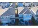 Aerial view of the homes showing roof, driveway, and landscaping in a residential neighborhood at 1292 Cascades Ave, Davenport, FL 33837