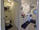 Well-lit bathroom with dual sinks, granite countertops, and modern fixtures at 1292 Cascades Ave, Davenport, FL 33837